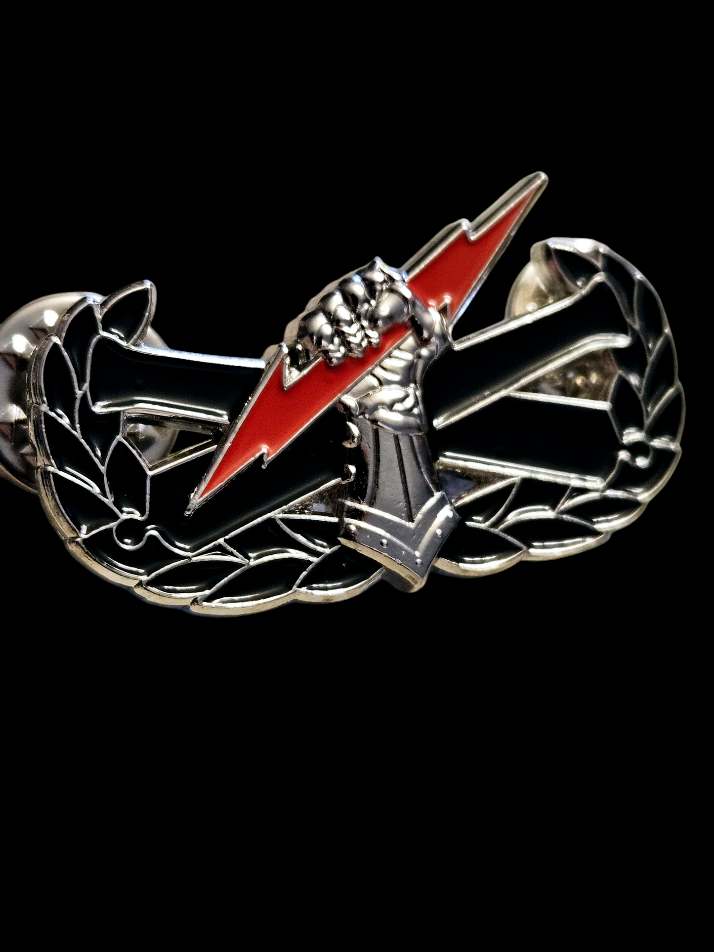 Colored "pin on" fist badge
