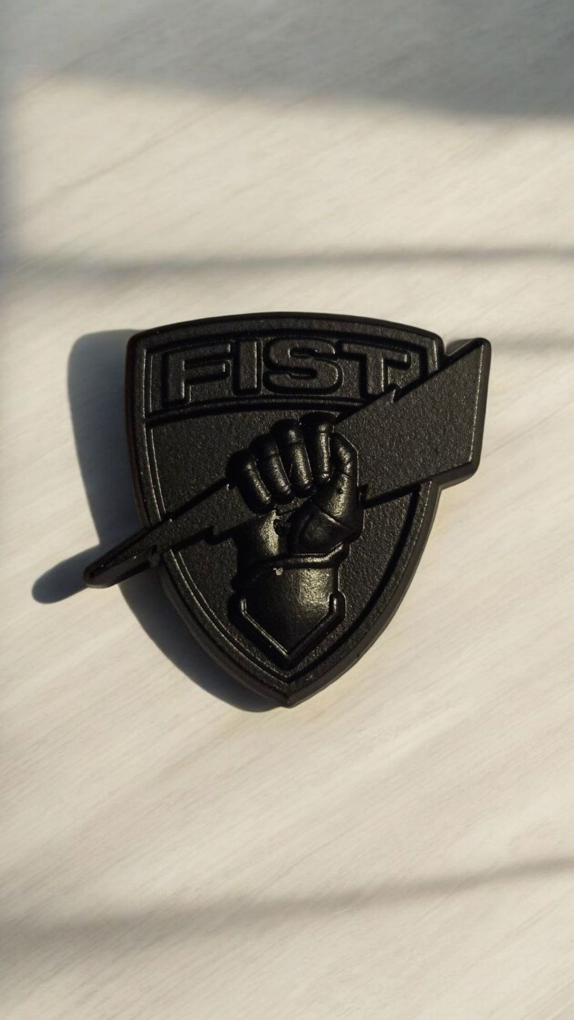 Black shield lapel pin