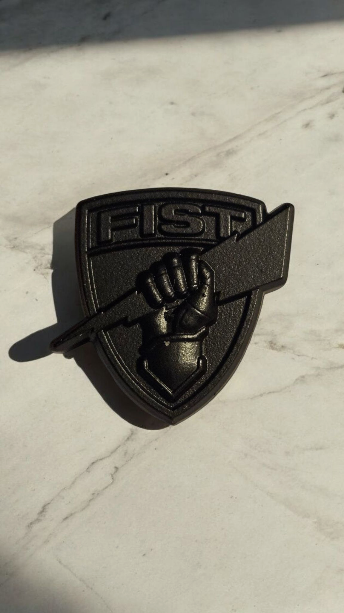 Black shield lapel pin
