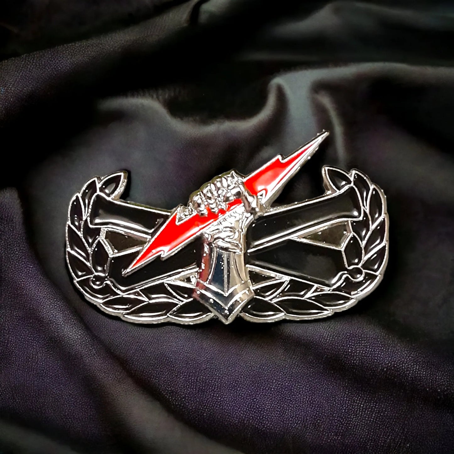 Colored "pin on" fist badge